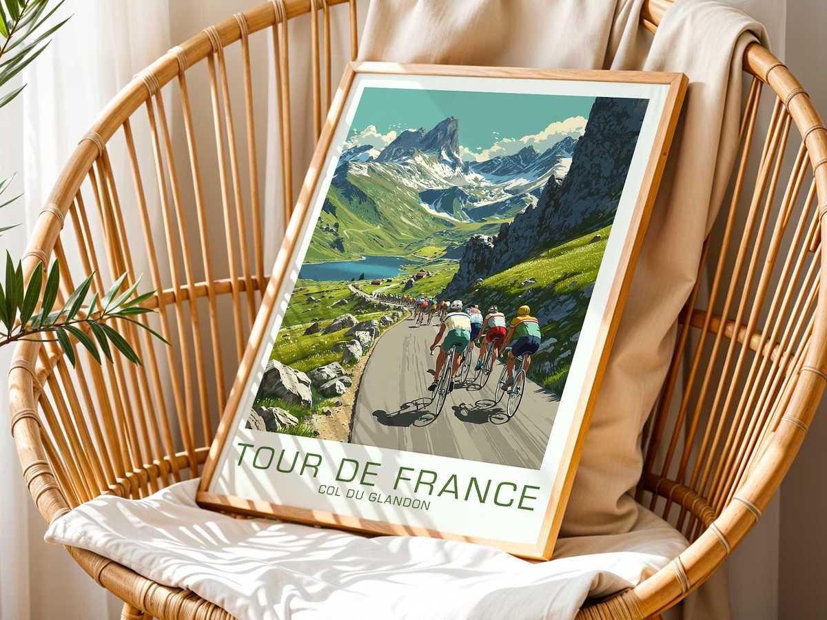 Close-up poster of a cyclist cresting a slope on the Col du Glandon, muscles strained and posture focused against mountain…