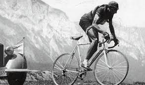 Fausto Coppi on the Giro d'Italia victory podium celebrating with the trophy and crowd