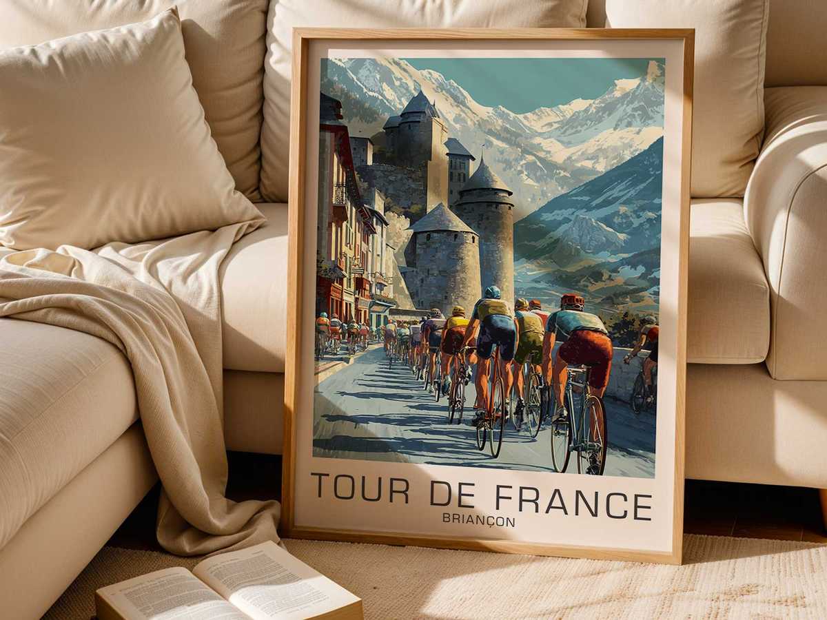 Historic fortified walls and ramps of Briançon with a racing cyclist climbing toward the citadel under clear light