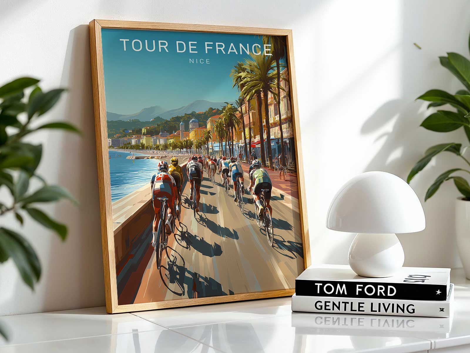 Framed Nice Tour de France poster displayed in a living room, pairing heritage art with contemporary decor