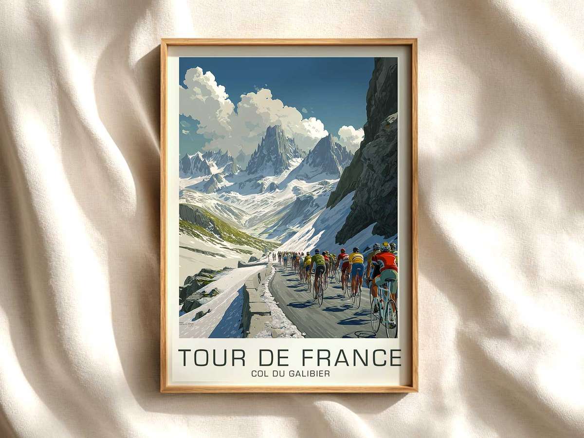 Poster showing Eddy Merckx riding up the Col du Galibier with winding road, high peaks and dramatic sky