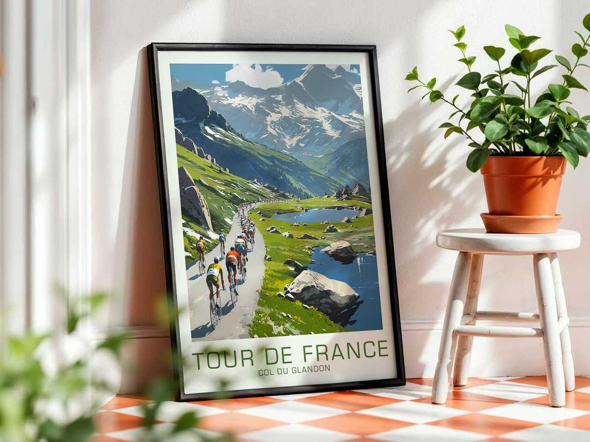 Portrait-style view of a cyclist’s exhausted face framed by the alpine backdrop of Col du Glandon