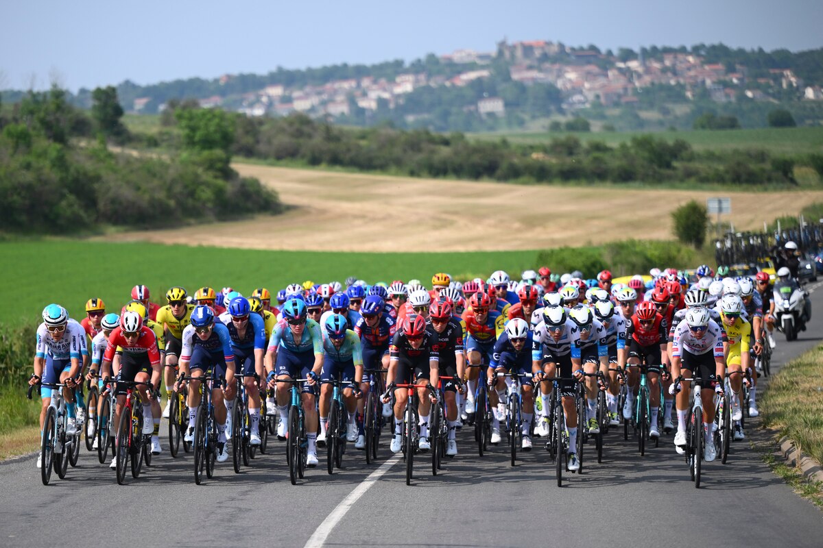 Professional road cycling team riding in formation during a team time trial practicing coordinated pacing