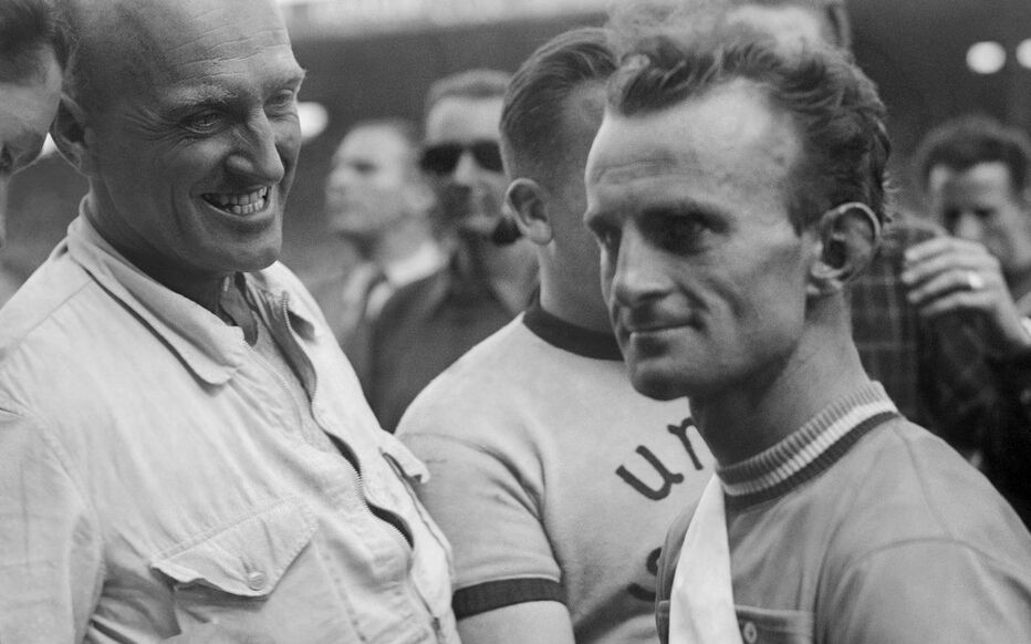 Black and white portrait of a young Jean Robic in cycling kit looking determined