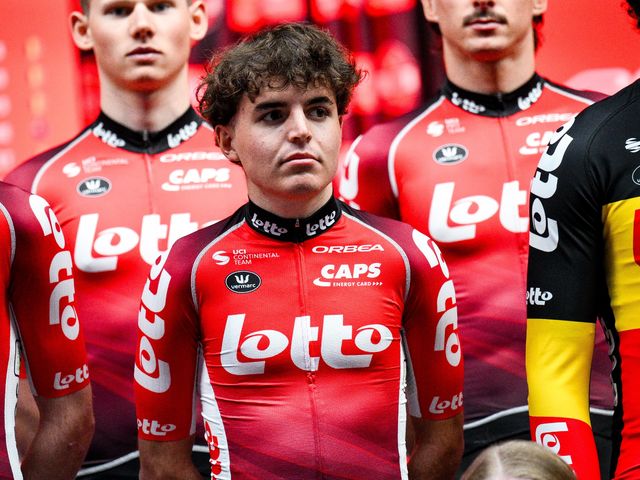 Lotto Cycling Team riders grouped in the peloton during a flat stage, showing mixed roster roles and team kit