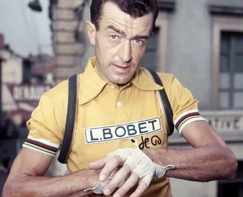 Louison Bobet training on a quiet road in preparation for the 1954 season, demonstrating his disciplined approach to…
