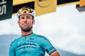 Mark Cavendish launching his final surge in a Tour de France bunch sprint with outstretched body and focused gaze