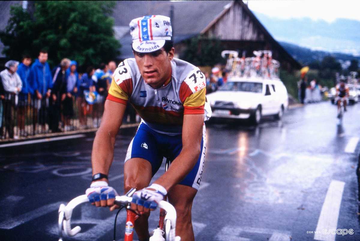 Miguel Indurain in aerodynamic time trial position on a flat open road during training