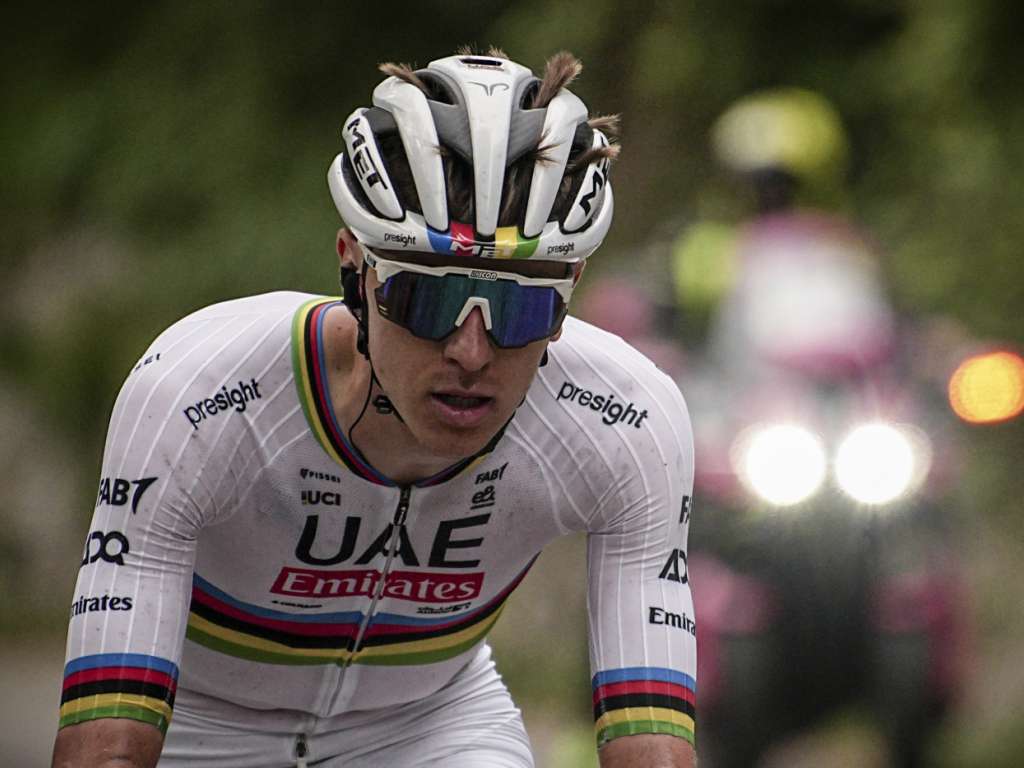 The peloton bunching together as it approaches a famous cobbled sector, teams reordering for the challenge