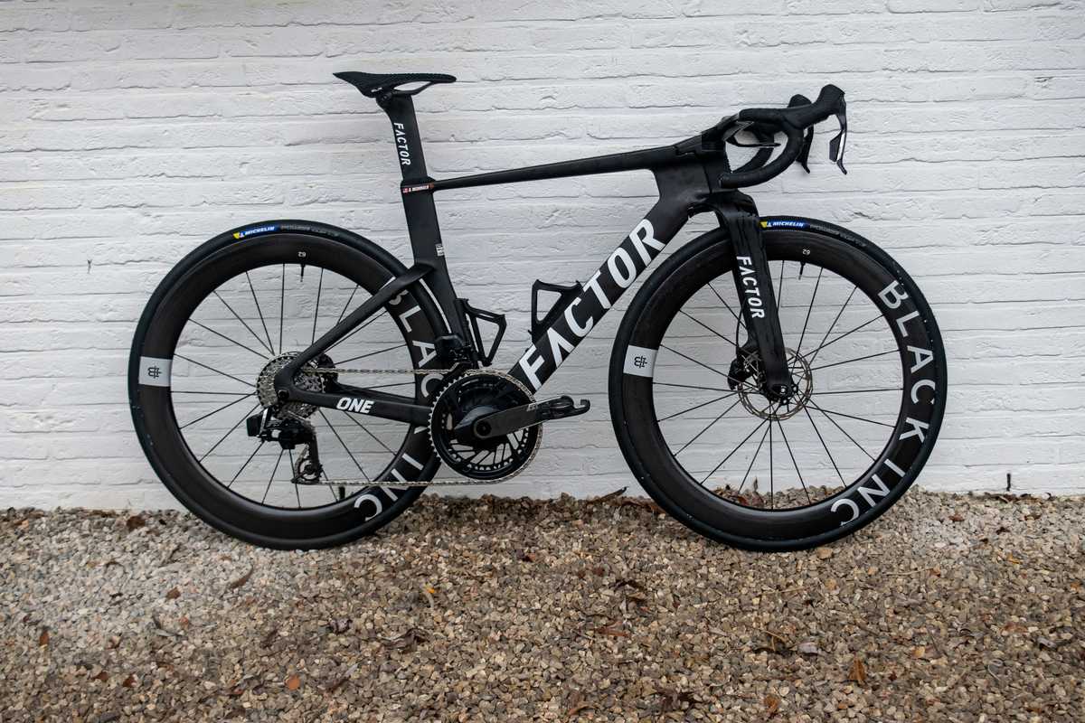 Close-up of an aerodynamic road bike frame used in the Tour de France showing tube shaping and integrated cockpit